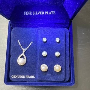 Pearl necklace and earrings set of three earrings.